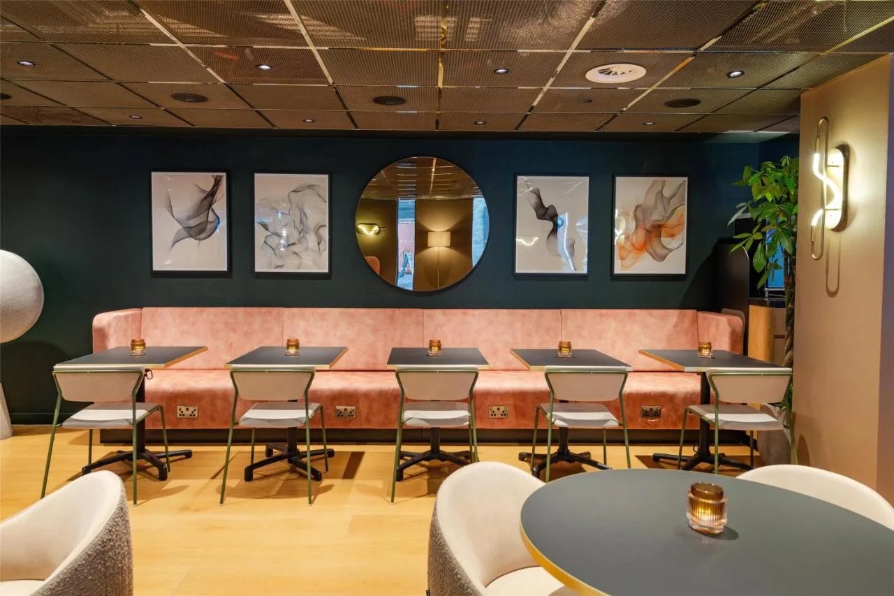 Restaurant with mirrored wall at YOTEL London City, London