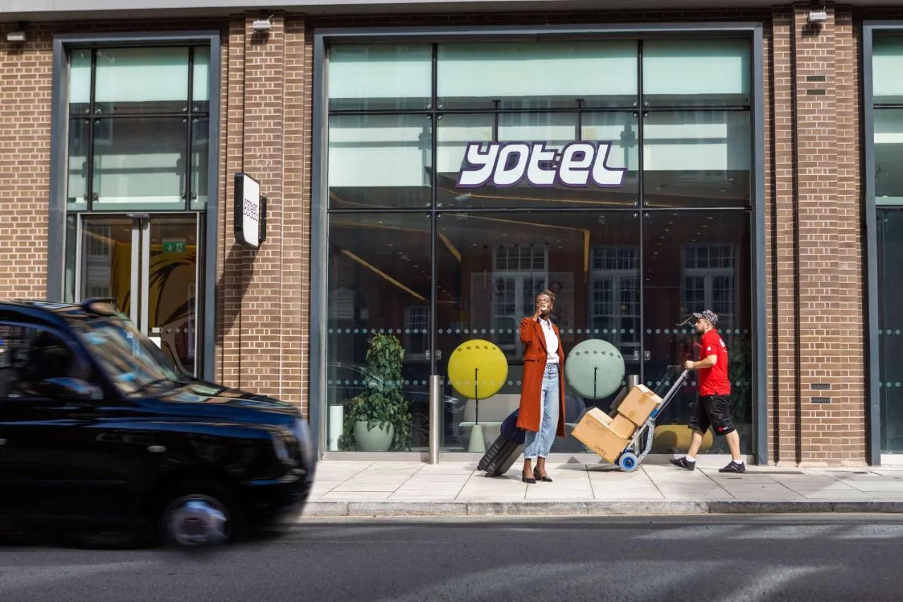 Guests walking with luggage near YOTEL London City, Clerkenwell Road